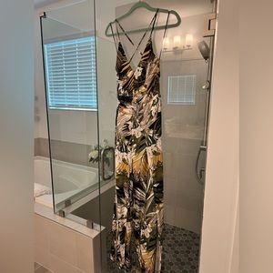 Jumpsuit with slits up leg shorts underneath and open back